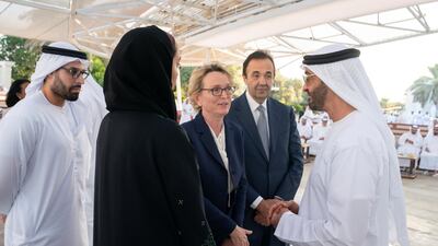 Sheikh Mohamed bin Zayed, Crown Prince of Abu Dhabi and Deputy Supreme Commander of the Armed Forces (R), speaks with Claude Chirac, the daughter of France's former President Jacques Chirac (3rd R), during a Sea Palace barza. Seen with Mohamed Khalifa Al Mubarak, chairman of the Department of Culture and Tourism and Abu Dhabi Executive Council Member (L). Hamad Al Kaabi / Ministry of Presidential Affairs ---