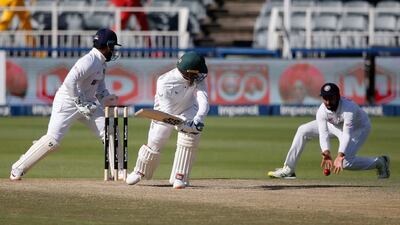 South Africa batsman Rassie van der Dussen watches the ball fall short of an India fielder. AFP