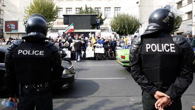 Iranian anti-riot police forces keep watch as protesters gather in front of the German embassy in Tehran on November 1. EPA