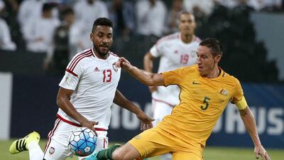 The UAE’s Khamis Ismail, left, vies with Australia’s Trent Sainsbury. Karim Sahib / AFP