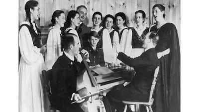From left, members of the Trapp family Eleonore, Agathe, Maria, Georg von Trapp, Johanna, Martina, Hedwig, Maria, and Johannes at a rehearsal in 1946. Also seen are Werner, playing the viola da gamba, and Father Franz Wasner on the spinet.