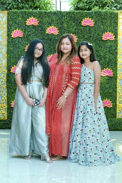 Anurradha Agaarwal, seen here with her daughters Riddhi and Anushka, hosts Modista exhibitions