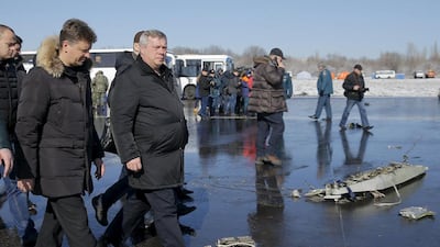 Russian Minister of Transport Maxim Sokolov and Vasily Golubev, the governor of Rostov region, visit the crash site on Sunday. Maxim Shemetov / Reuters