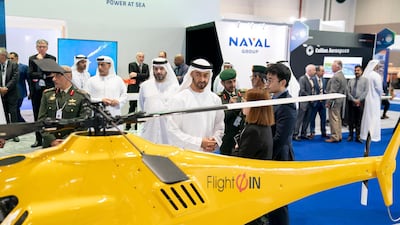 Sheikh Mohamed bin Zayed, Crown Prince of Abu Dhabi and Deputy Supreme Commander of the Armed Forces, tours the Unmanned System Exhibition and Conference (Umex) 2020, at Adnec. Seen with Faisal Al Bannai, chief executive and managing director of Edge, back centre. All photos courtesy Ministry of Presidential Affairs