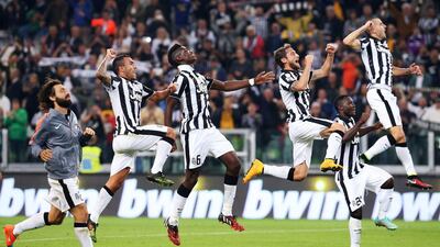 Juventus’ players show their relief after overcoming Roma on Sunday with a 3-2 win at Turin. Marco Bertorello / AFP