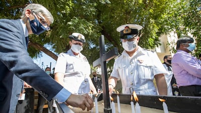 Candles are lit in remembrance. Ruel Pableo for The National