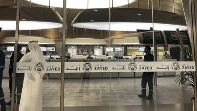 Adnoc employees outside the company’s control room for gas processing facilities at Ruwais Refinery. Jennifer Gnana / The National