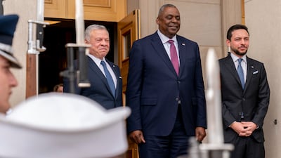 Secretary of Defense Lloyd Austin, centre, stands with King Abdullah II, left, and Crown Prince Hussein during a honour cordon at the Pentagon in Washington on May 12, 2022. AP Photo