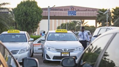 Taxis parked near International City. Many drivers have complained about the accommodation problems they face. Mona Al Marzooqi / The National