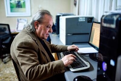 Sener Levent, chief editor of Afrika Gazetesi newspaper, works on an article in the outlet's newsroom at its headquarters in the northern side of the Cypriot capital Nicosia. AFP