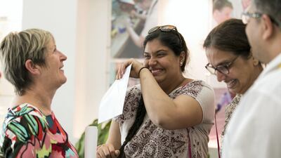 Devika Dahiya cries in joy upon learning here A-level examination results at Jumeirah College School. Reem Mohammed / The National