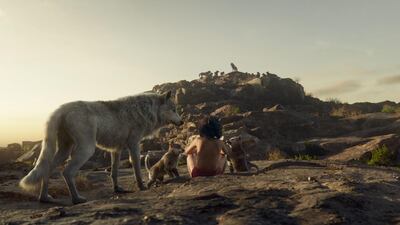 Mowgli with his wolf mother, Raksha. Courtesy Disney