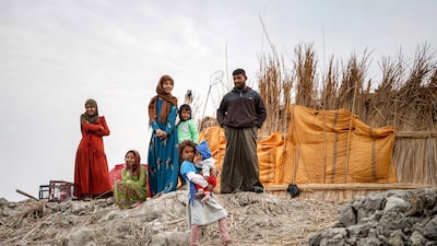 Samir Abdullah poses with his family. All photos: Ishtar Obaid