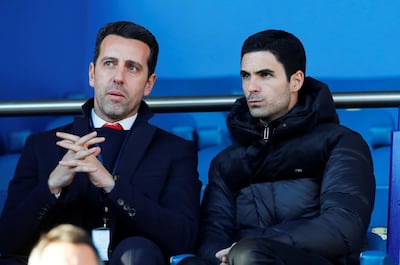 New Arsenal manager Mikel Arteta watches from the stands alongside technical director Edu. Reuters