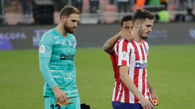 Atletico Madrid players react at the end of the Spanish Super Cup Final soccer match between Real Madrid and Atletico Madrid at King Abdullah stadium in Jeddah, Saudi Arabia, Monday, January 13, 2020. AP Photo/Hassan Ammar