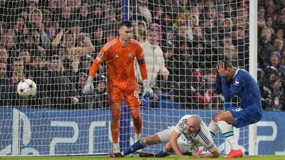 Chelsea's Thiago Silva, right reacts after missing a chance. AP