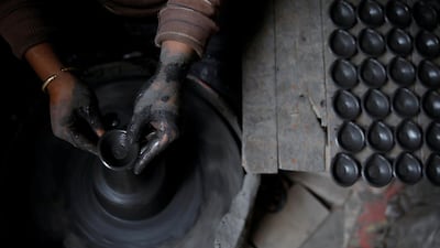 A potter makes earthenware oil lamps or "Diyo" used to decorate temples and homes ahead of Tihar festival, also called Diwali, the Hindu festival of lights, in Bhaktapur, Nepal October 20, 2019. Reuters