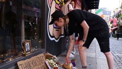 A person pays tribute to O'Connor at the Irish Rock 'n' Roll Museum