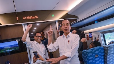 Indonesia's President Joko Widodo, right, is accompanied by Transport Minister Budi Karya Sumadi on board the train during a test ride in Jakarta. EPA