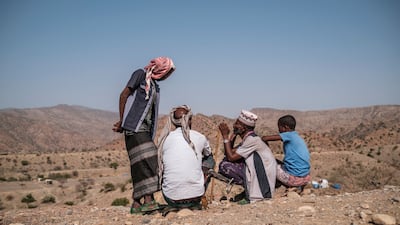 Internally displaced people gather near Erebti, Ethiopia. AFP