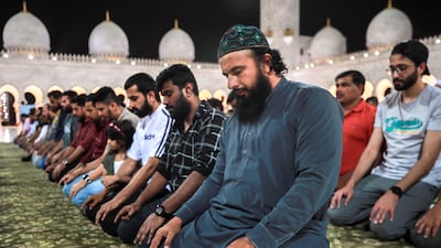 Isha prayers held at the mosque. Victor Besa / The National