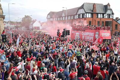 Liverpool players celebrate after winning the Uefa Champions League this summer. Nigel Roddis / Getty Images