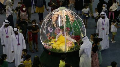 People gather at a stand during the Sharjah Children's Reading Festival. EPA