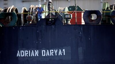 A crew member takes pictures of Iranian oil tanker Grace 1, now renamed Adrian Darya 1, as it sits anchored in the Strait of Gibraltar, Spain, August 18, 2019. Reuters