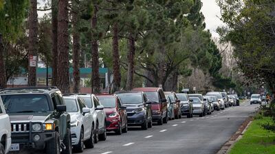 Residents queue up for sandbags at a City of Oakland site before the storm. Bloomberg