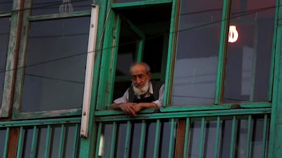 A man looks out of the window of a restaurant in Kabul on June 12, 2014. Ahmad Masood / Reuters