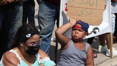 Relatives and families of prisoners at Roumieh prison carrying placards during a symbolic sit-in at Ryad Al-Solh square, Beirut, Lebanon. EPA
