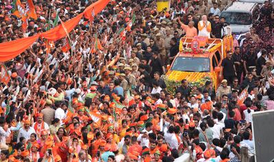 BJP leader and Indian Prime Minister Narendra Modi and Chief Minister of Uttar Pradesh, Yogi Adityanath gesture to their supporters during a road show in Varanasi, Uttar Pradesh, India. EPA