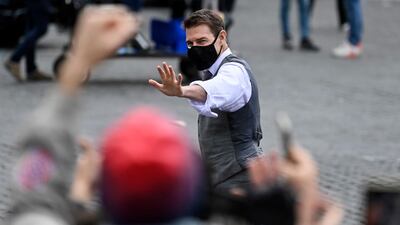 Tom Cruise greets fans during the shooting of 'Mission: Impossible 7' at Piazza Venezia in Rome, Italy on November 29, 2020. EPA