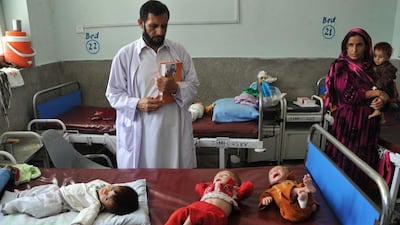 Afghan children suffering from severe malnutrition receive treatment at a public hospital in Jalalabad. Noorullah Shirzada / AFP Photo