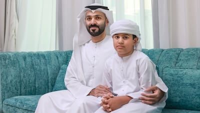Rashed Al Kaabi and his son Mohamed, 7. Victor Besa / The National