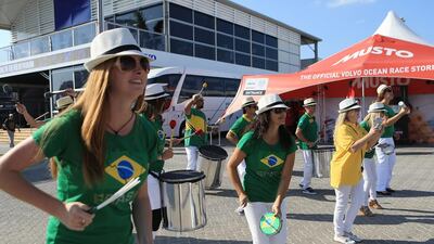 A group of UAE residents put on a performance of Brazilian music as they dance on the opening day of the Volvo Ocean Race Village, in Abu Dhabi. Ravindranath K / The National