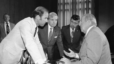 Secretary of State designate George Shultz, right, speaks with members of the Senate Foreign Relations Committee on Capitol Hill in Washington on July 13, 1982. From left are senators Joseph Biden, Charles Percy and Edward Zorinsky. AP