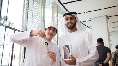 Brothers Faisal and Khalid Al Jaziri got a Apple watch series 4 and iPhone xs at the launch of iPhone XS in Dubai Mall. All photos Leslie Pableo for The National