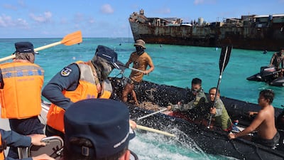 Philippines Navy personnel and Chinese coastguards clash near a grounded warship, the BRP Sierra Madre, that Manila uses as a military outpost in the South China Sea. Reuters
