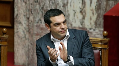 Greek Prime Minister Alexis Tsipras applauds after a speech of Greek Alternate Minister of Foreign Affairs George Katrougalos during a parliament session. Reuters