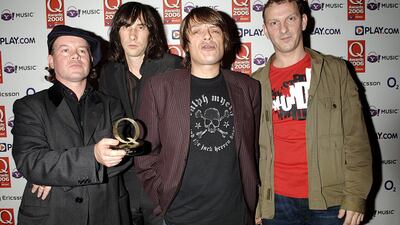 Scottish rock band Primal Scream with their Q Groundbreaker Award during the Q Awards 2006, in London. Martin Duffy, left, who played the keyboard for Primal Scream and The Charlatans, has died aged 55. PA