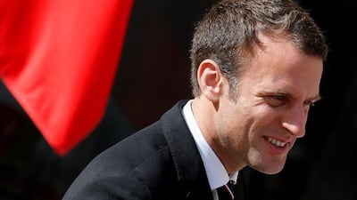 French president Emmanuel Macron reacts after a meeting and family photo with the International Olympic Committee Evaluation Commission at the Elysee Place in Paris. Gonzalo Fuentes / Reuters