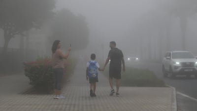 A street in Dubai. Fog blanketed the UAE on Thursday morning. Pawan Singh for The National