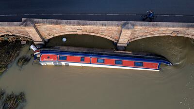A barge on its side in the Soar river after being swept away in flooding in the aftermath of Storm Henk. Reuters
