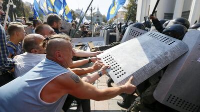 Around 100 people were injured on Monday including around 90 police, with authorities detaining some 30 people. Valentyn Ogirenko / Reuters