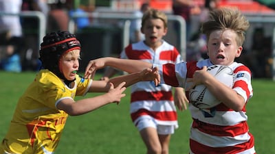 The Heartbeat Sports Tigers offender (right) broke away from a Hurrican tackle during game action on Friday, January 22, 2016, at the HSBC Rugby Festival Dubai. DELORES JOHNSON / The National