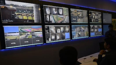 Pakistani security officers monitor the area around Gaddafi Cricket Stadium in Lahore, ahead of Zimbabwe's tour of Pakistan, on Monday. Arif Ali / AFP
