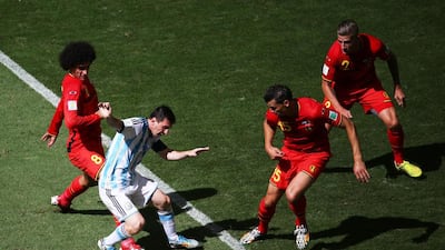 Marouane Fellaini of Belgium challenges Lionel Messi of Argentina during their match on Saturday at the 2014 World Cup in Brasilia, Brazil. Jamie Squire / Getty Images