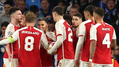 Arsenal players celebrate with Leandro Trossard after scoring the opening goal of the second leg. EPA