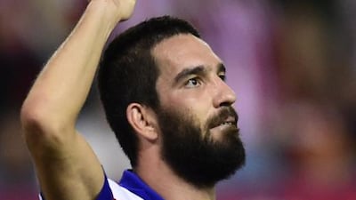 Atletico Madrid's Turkish midfielder Arda Turan celebrates after scoring during a Uefa Champions League match against Juventus. Barcelona announced on July 6, 2015 the signing of Arda Turan for the next five seasons. AFP PHOTO/ JAVIER SORIANO